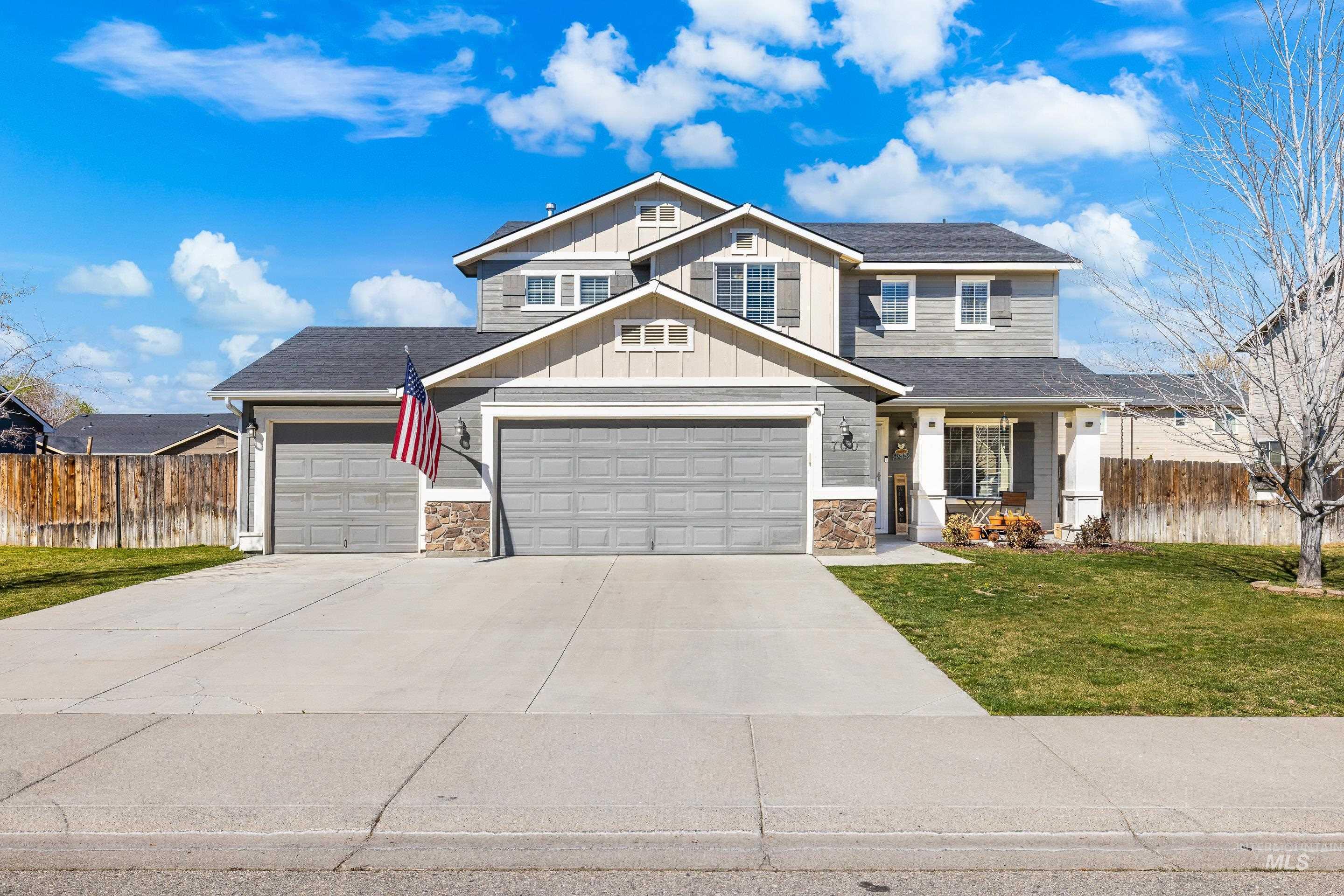 700 Southwest Panner Street Mountain Home, ID 83647 - Photo 2 of 50 Craftsman house featuring board and batten siding, stone siding, concrete driveway, an attached garage, and a shingled roof