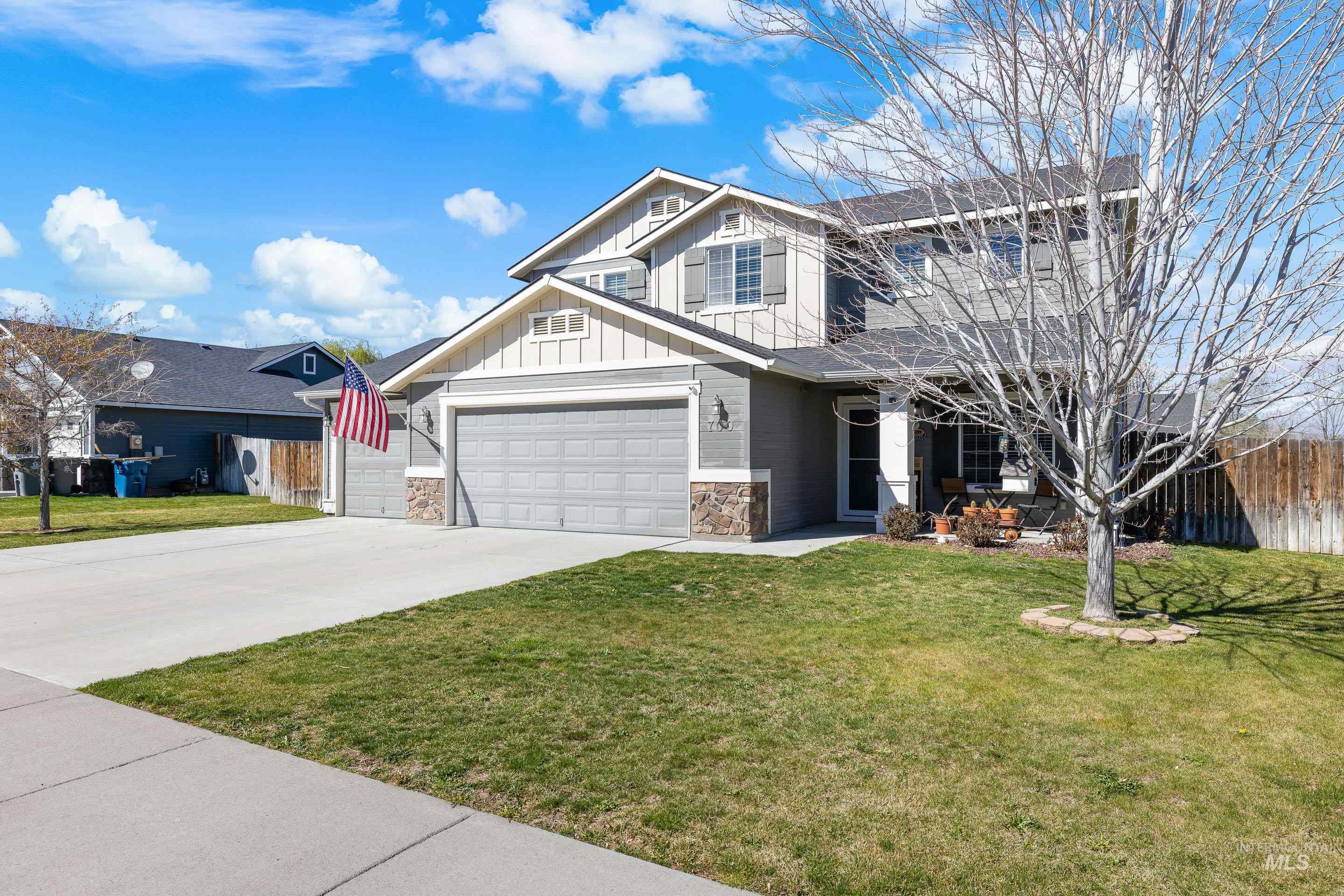 700 Southwest Panner Street Mountain Home, ID 83647 - Photo 3 of 50 Craftsman inspired home with stone siding, board and batten siding, concrete driveway, and a garage