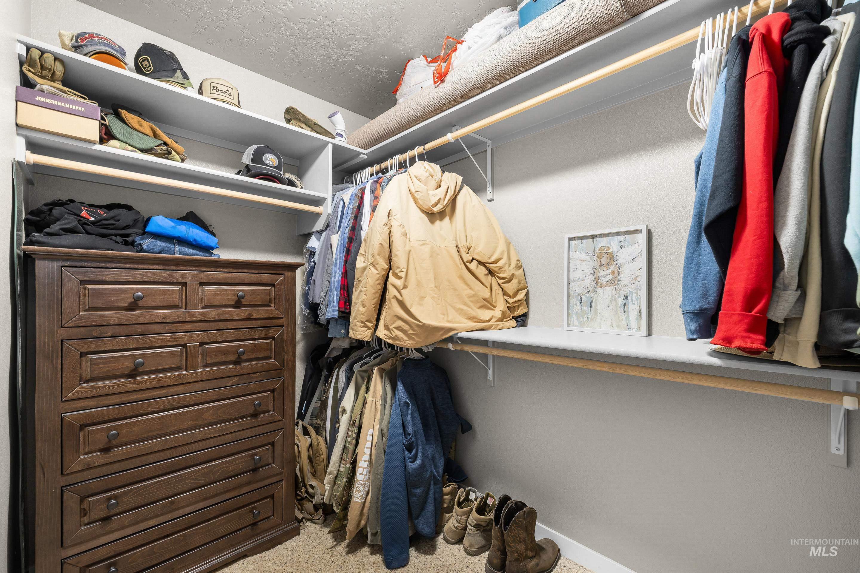 700 Southwest Panner Street Mountain Home, ID 83647 - Photo 36 of 50 Walk in closet featuring carpet