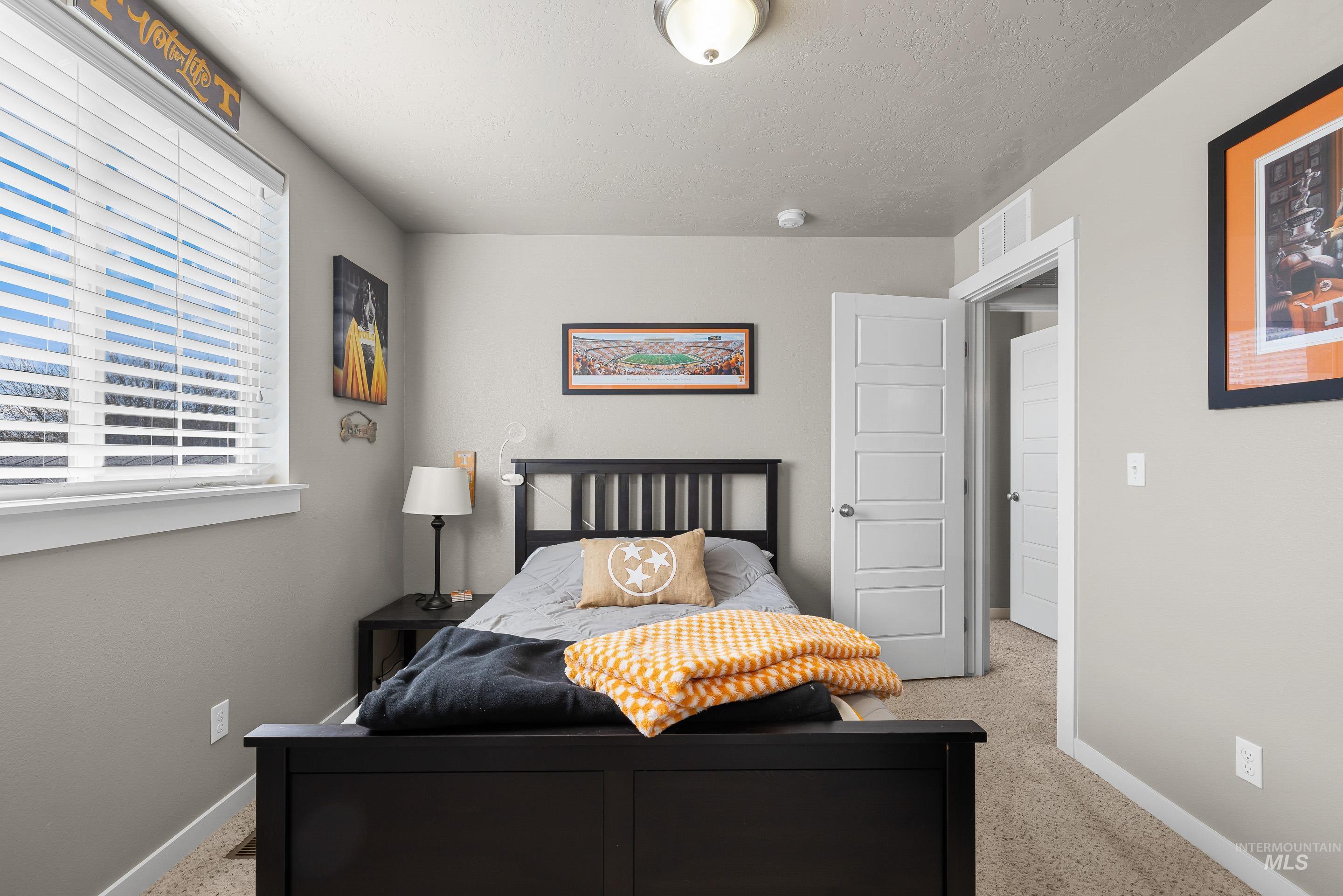 700 Southwest Panner Street Mountain Home, ID 83647 - Photo 37 of 50 Bedroom with baseboards and carpet