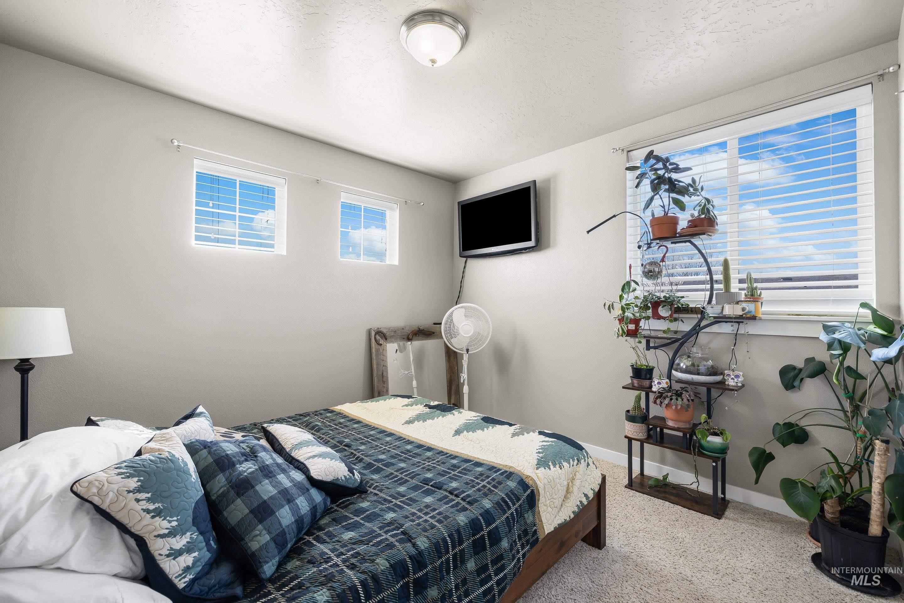 700 Southwest Panner Street Mountain Home, ID 83647 - Photo 42 of 50 Bedroom featuring baseboards and light colored carpet