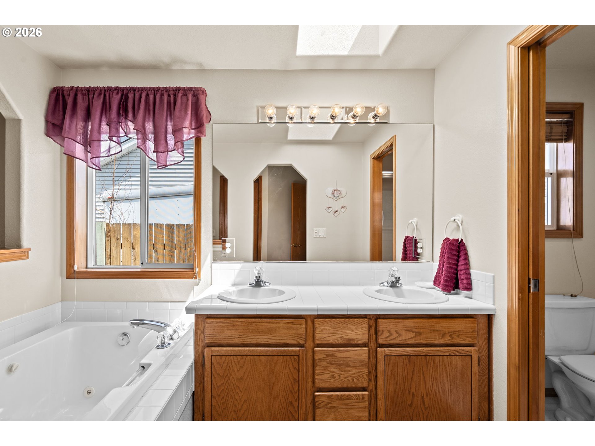 3081 Southwest 31st Street Gresham, OR 97080 - Photo 13 of 38 a bathroom with a tub sink and mirror