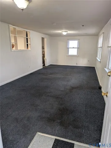 a view of an empty room and window