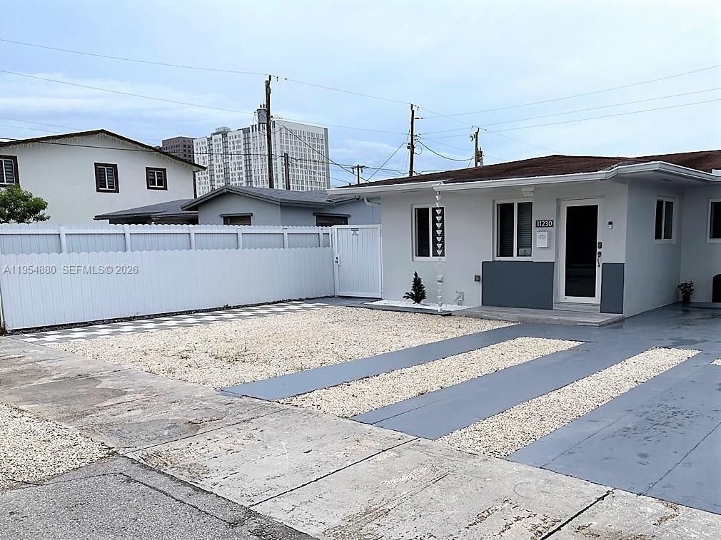 11230 Southwest 5th Street, Unit 1 Sweetwater, FL 33174 - Photo 19 of 25 a house view with a outdoor space
