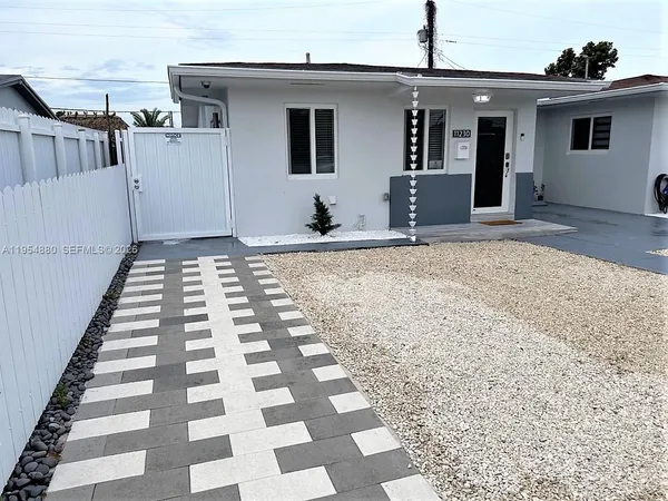 a front view of a house with a checkered floor