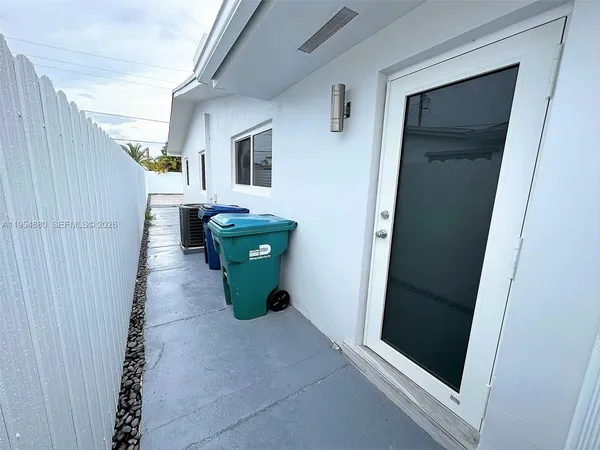 a view of an entryway with a door