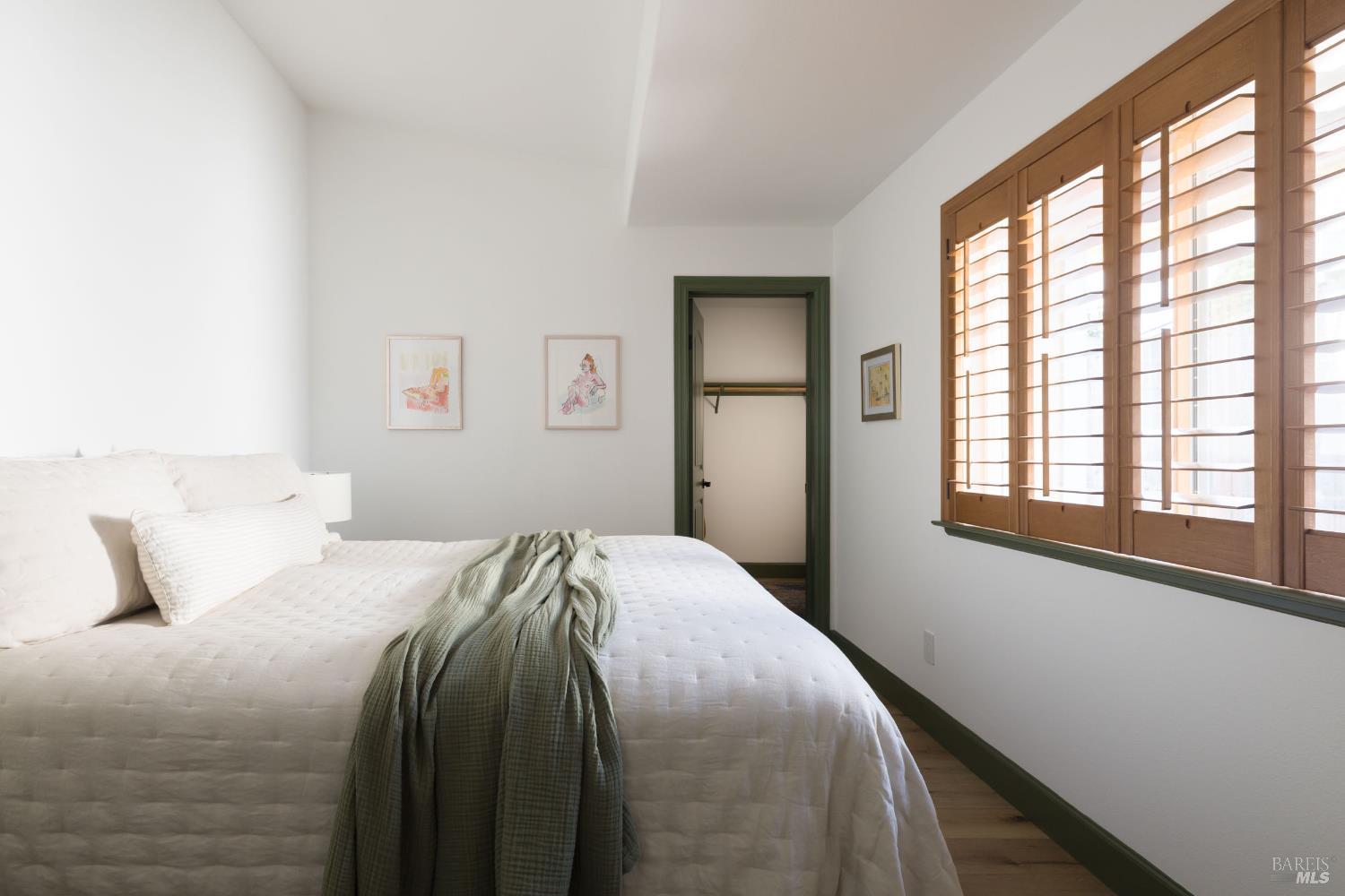 14632 Jomark Lane Occidental, CA 95465 - Photo 16 of 29 a bedroom with a bed and a large window