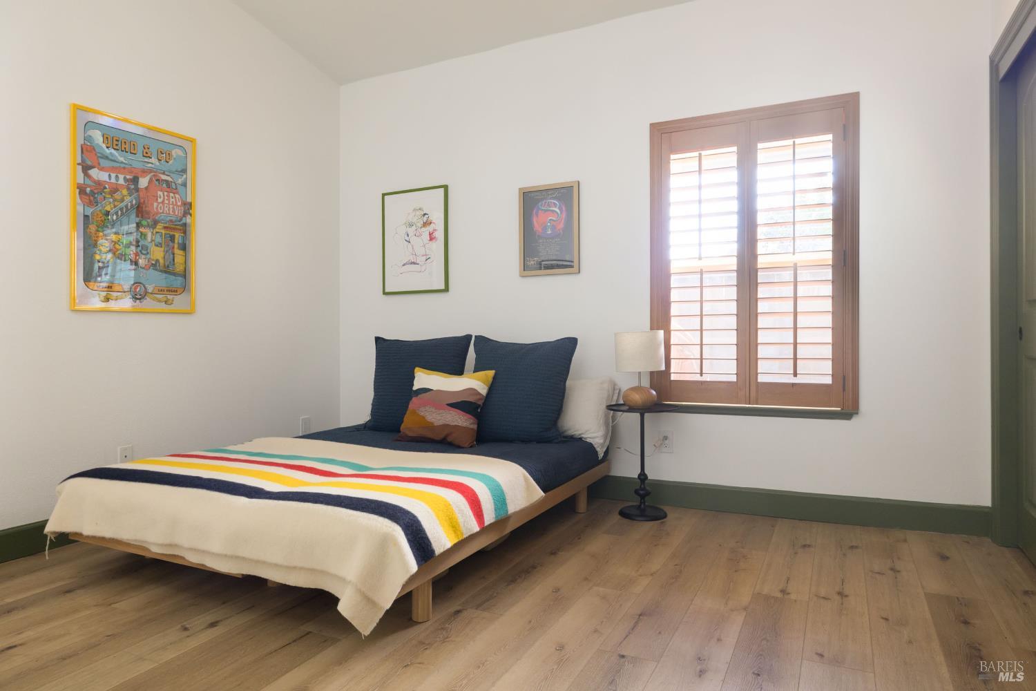 14632 Jomark Lane Occidental, CA 95465 - Photo 18 of 29 a bed sitting in a bedroom next to a window