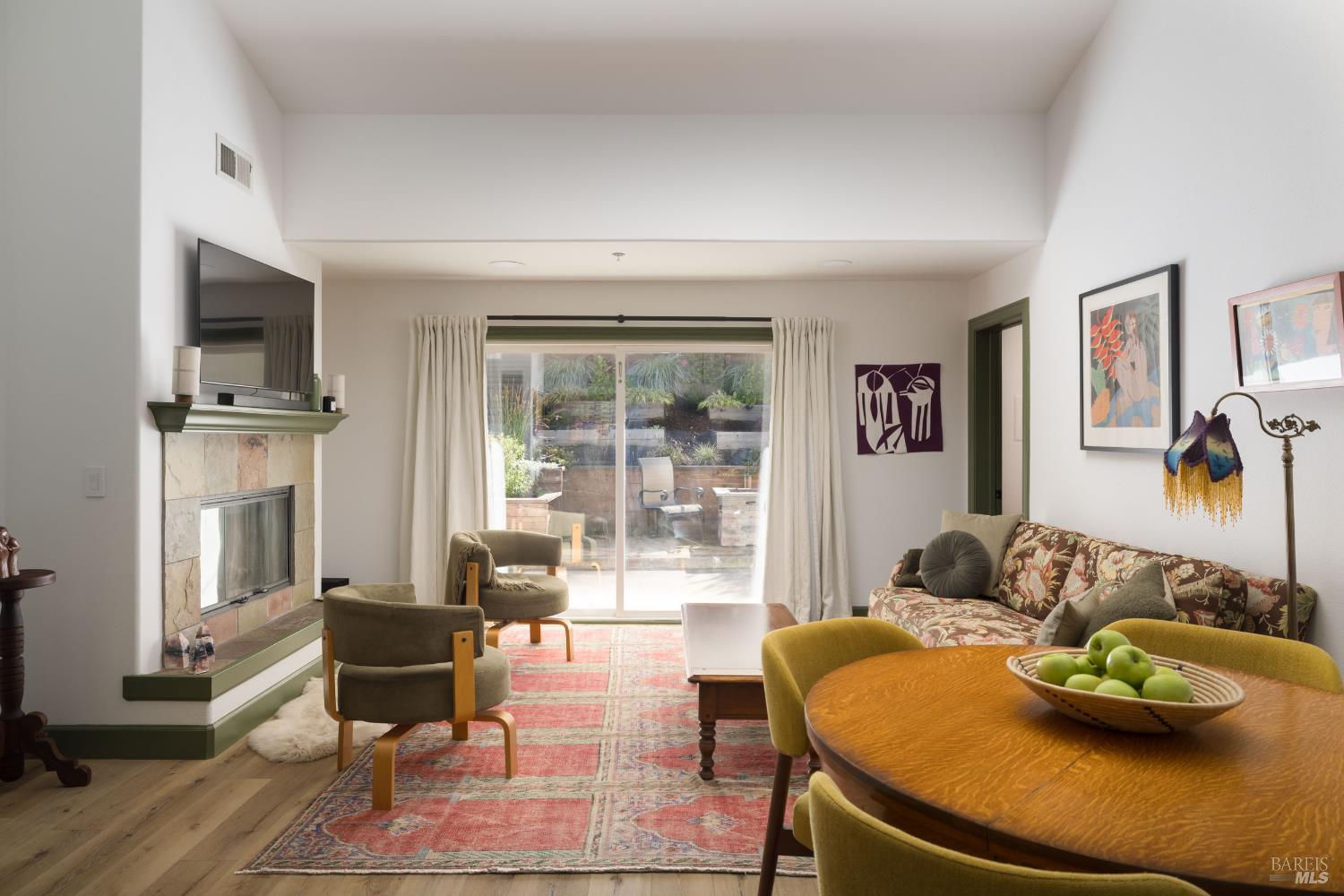 14632 Jomark Lane Occidental, CA 95465 - Photo 2 of 29 a living room with furniture and a flat screen tv