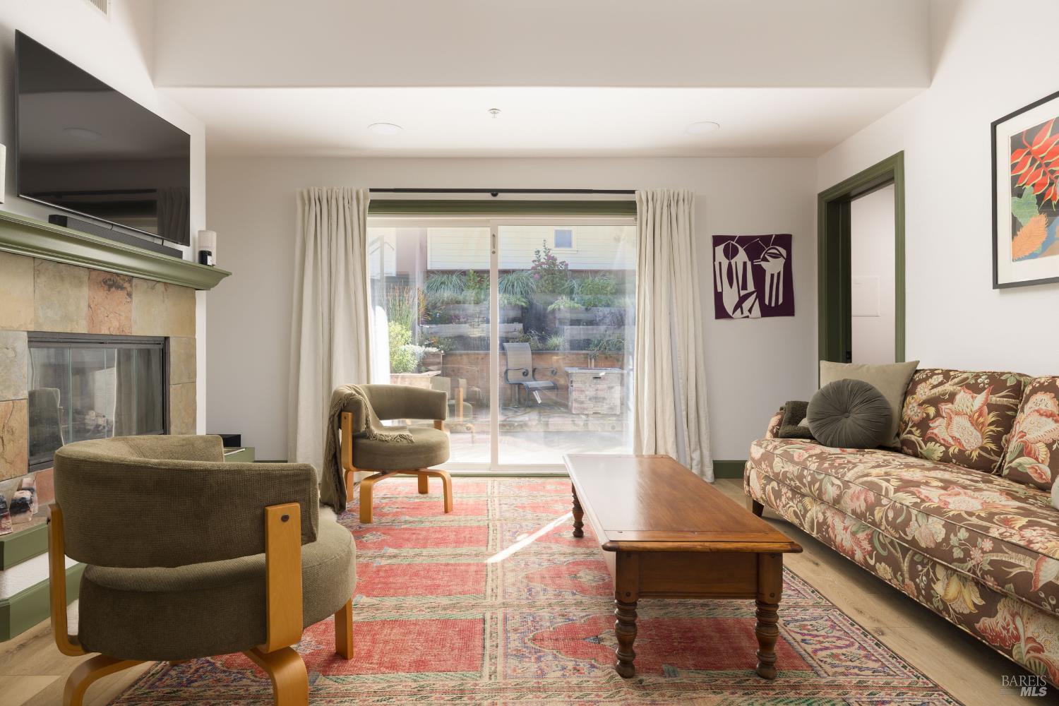 14632 Jomark Lane Occidental, CA 95465 - Photo 7 of 29 a living room with furniture and a flat screen tv