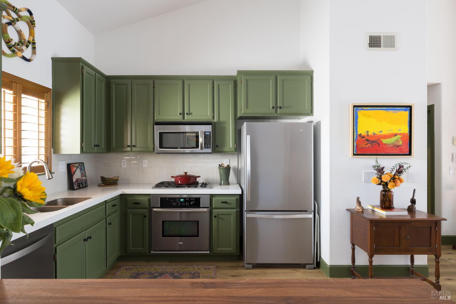 14632 Jomark Lane Occidental, CA 95465 - Photo 9 of 29 a kitchen with stainless steel appliances a stove a refrigerator and a sink
