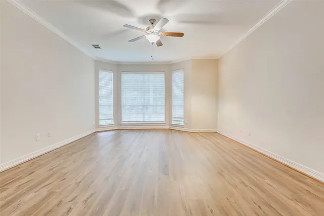 a kitchen with stainless steel appliances a kitchen island hardwood floor and a sink