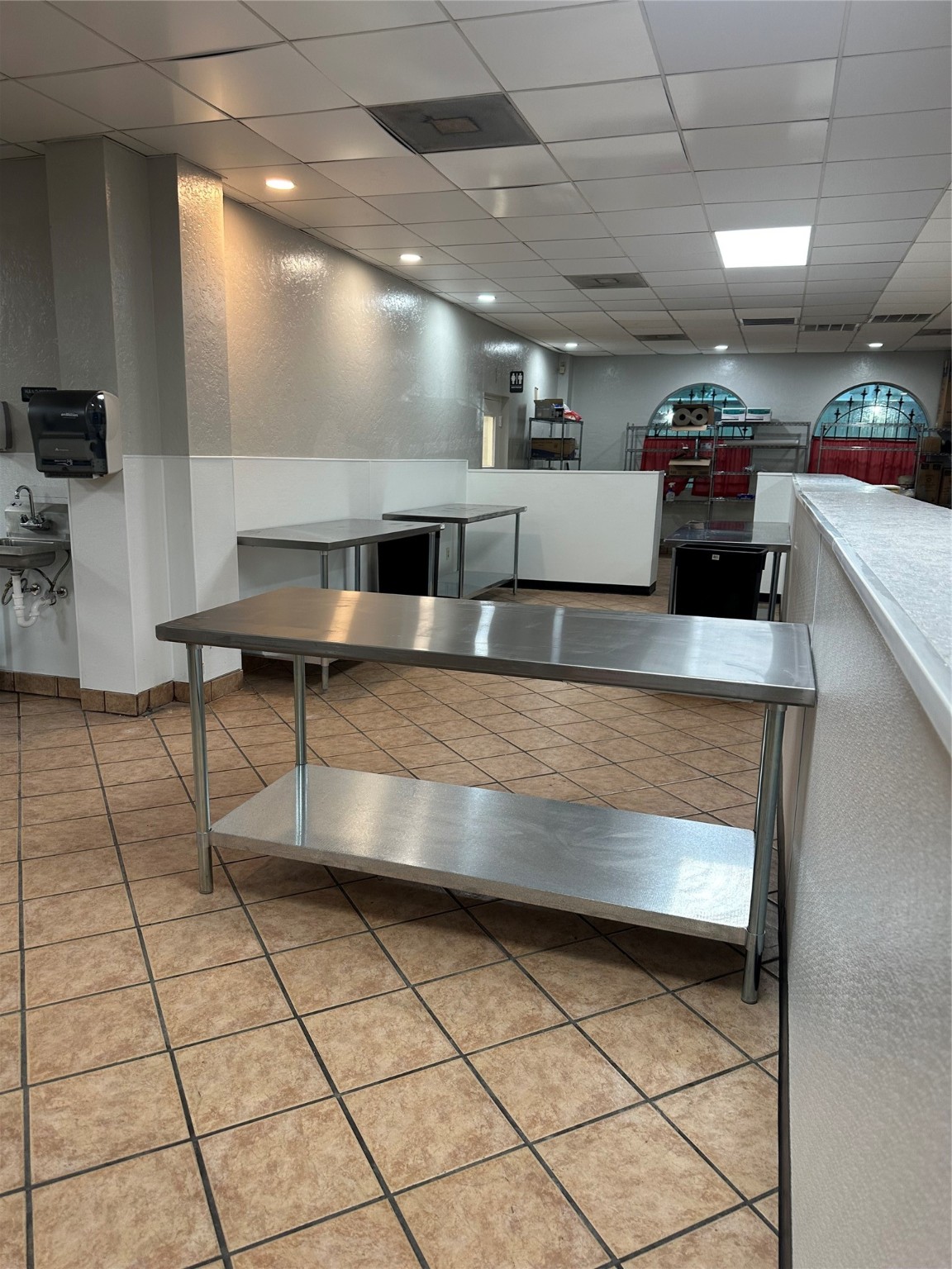 7820 Fulton Street Houston, TX 77022 - Photo 12 of 23 a kitchen with kitchen island a counter top space a sink and cabinets