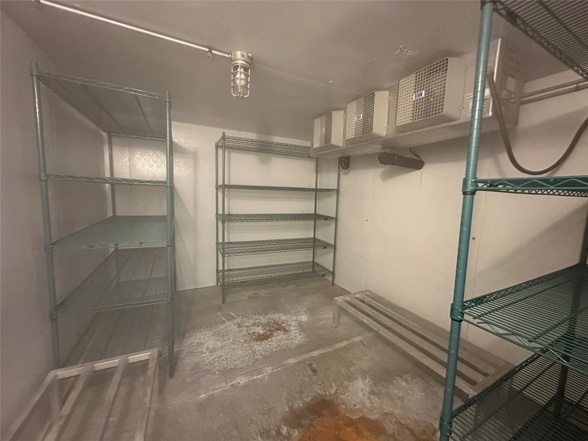 7820 Fulton Street Houston, TX 77022 - Photo 15 of 23 a view of a room with racks on the wall