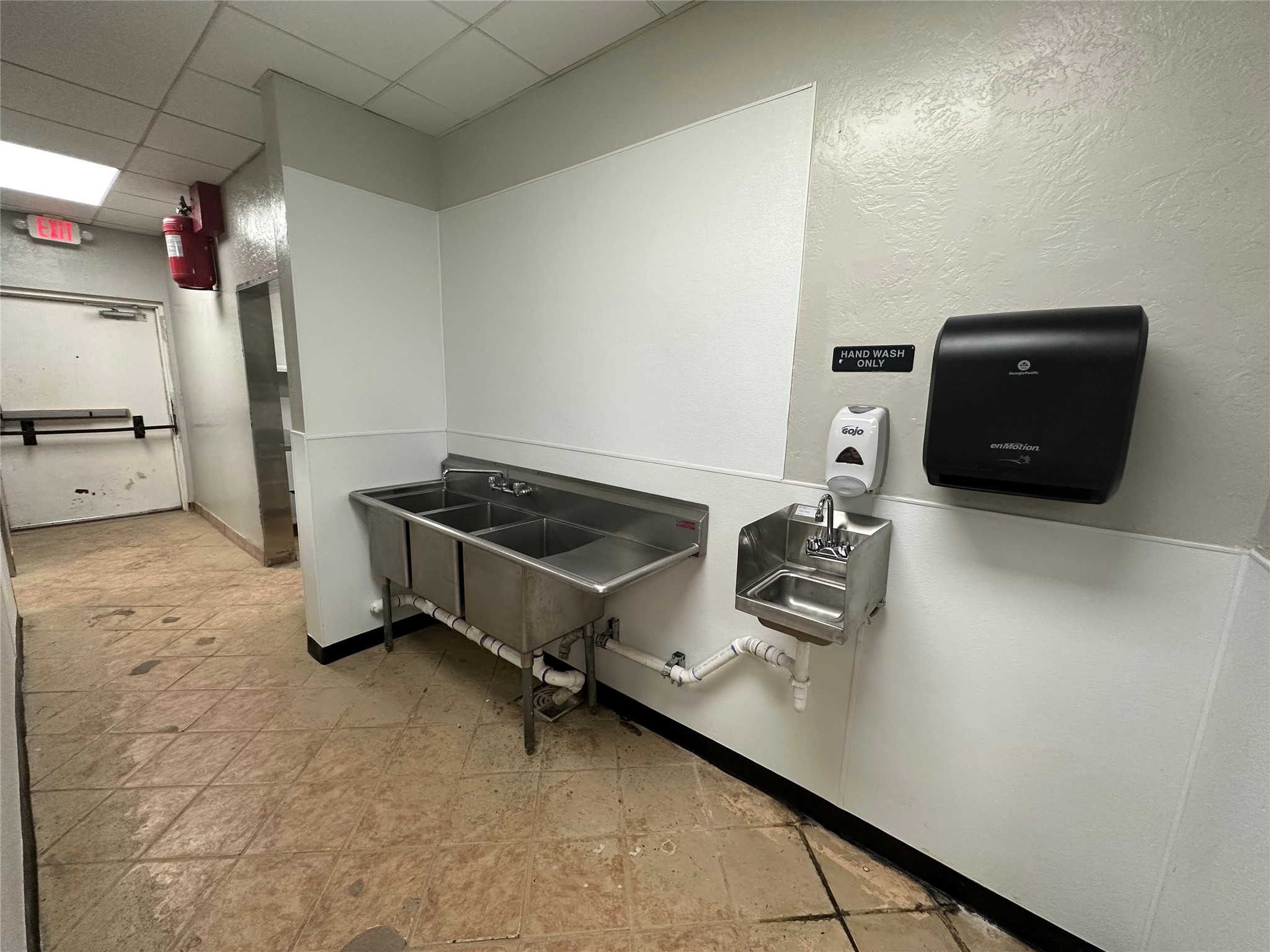 7820 Fulton Street Houston, TX 77022 - Photo 23 of 23 a room with storage and utility