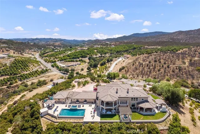 a living room with furniture a fireplace and a table