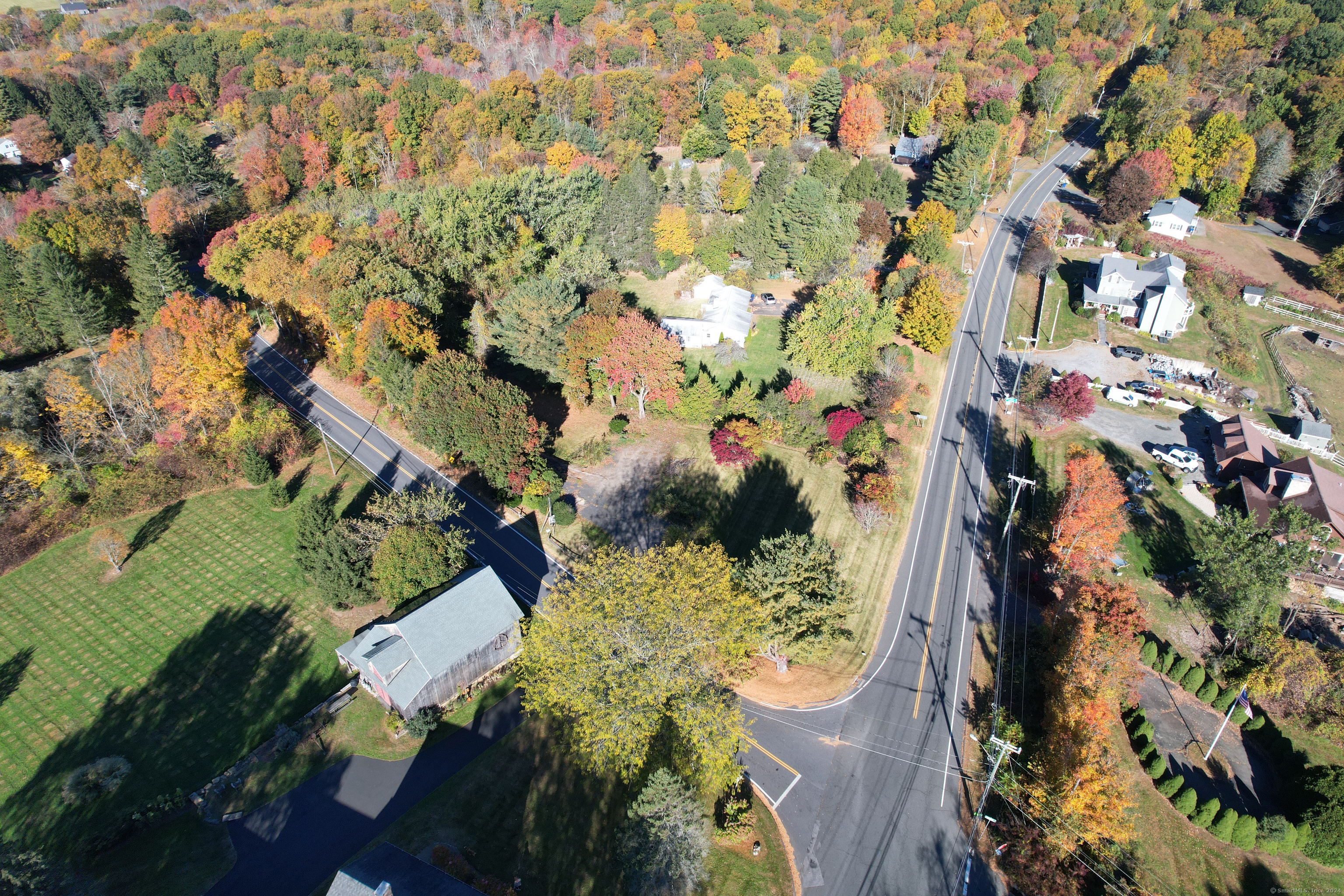 1543 Litchfield Road Watertown, CT 06795 - Photo 6 of 7 an aerial view of residential house with outdoor space and trees all around