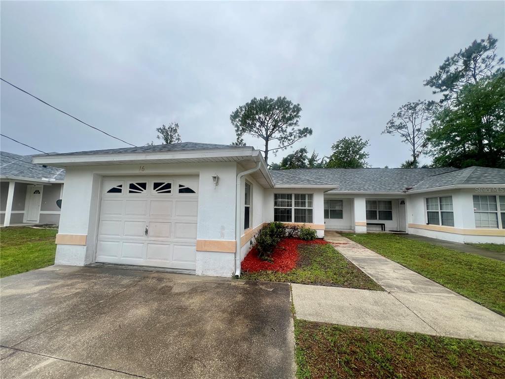 front view of a house with a yard