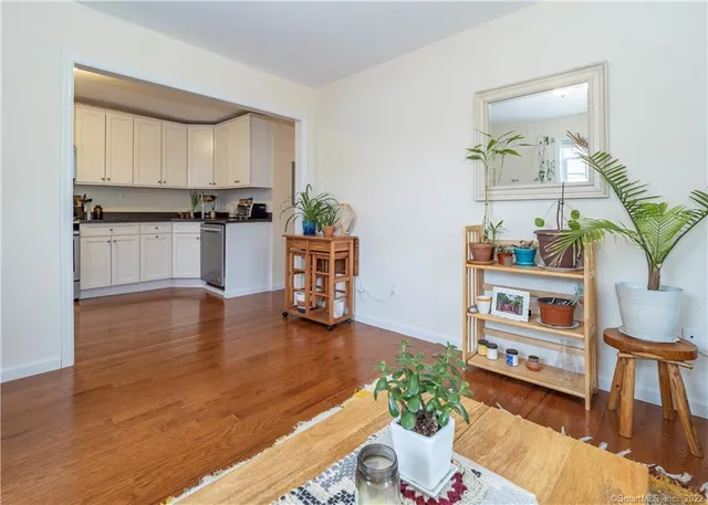 a view of kitchen with furniture and wooden floor