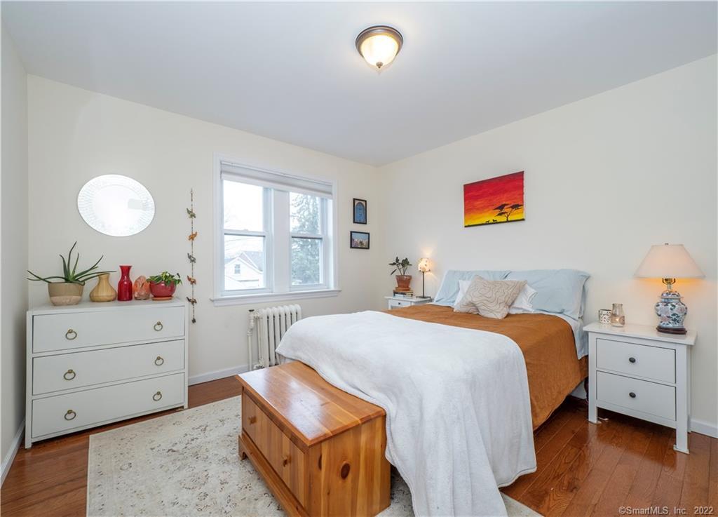 115 Main Street, Unit 5 Norwalk, CT 06851 - Photo 15 of 23 a bedroom with a bed and a window