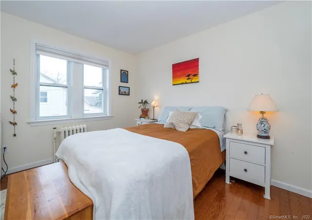 a bedroom with bed and window