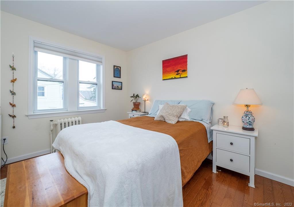 115 Main Street, Unit 5 Norwalk, CT 06851 - Photo 17 of 23 a bedroom with bed and window