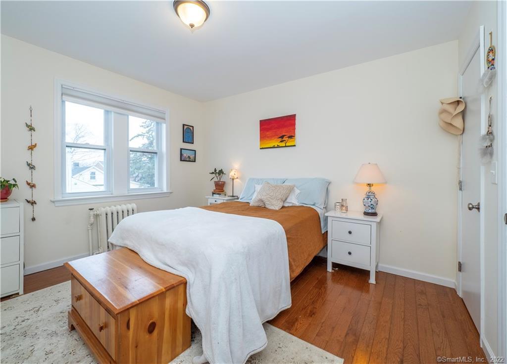 115 Main Street, Unit 5 Norwalk, CT 06851 - Photo 19 of 23 a bedroom with a bed and a window