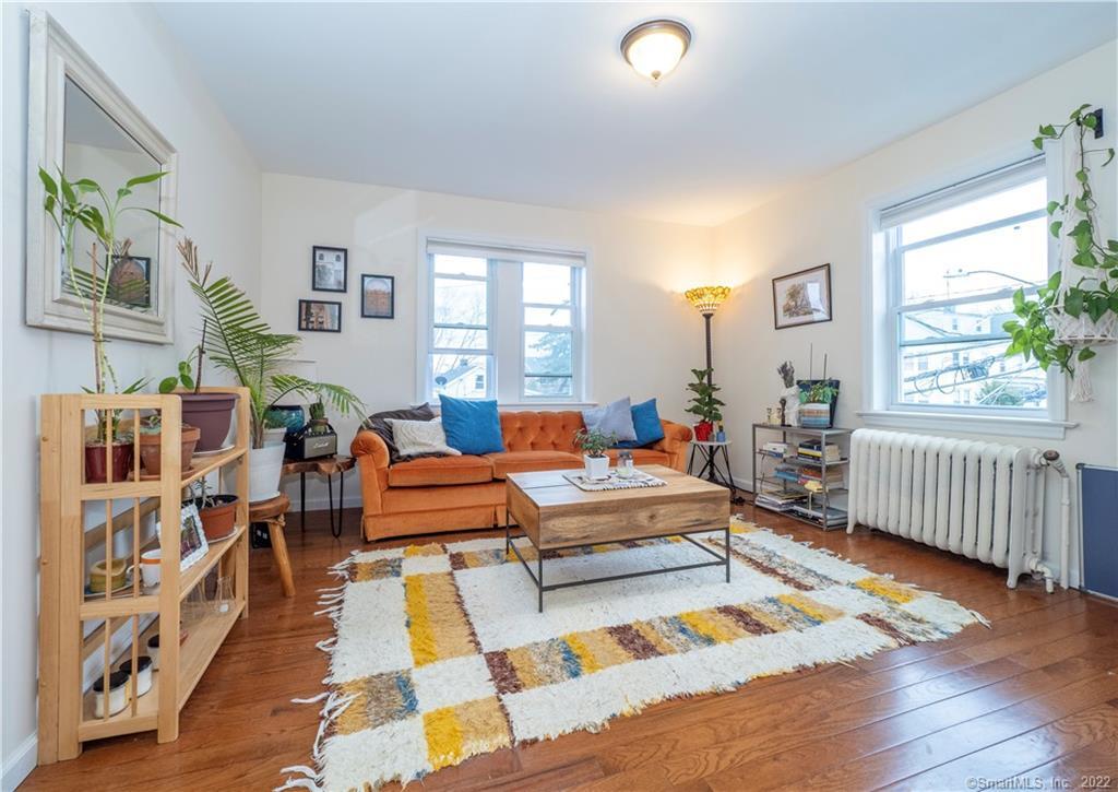 115 Main Street, Unit 5 Norwalk, CT 06851 - Photo 2 of 23 a living room with furniture and a rug
