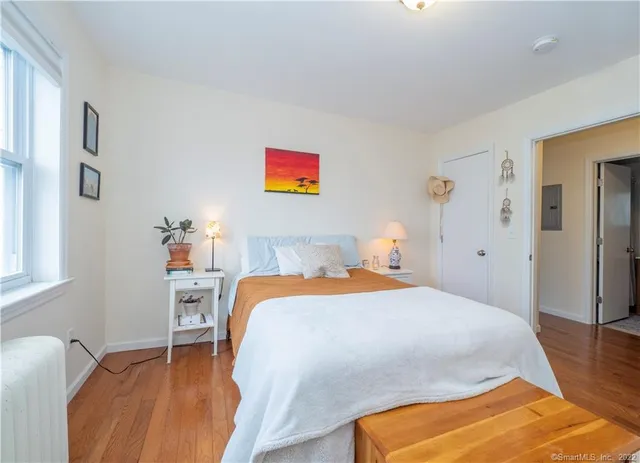 a bedroom with a bed and a table in it