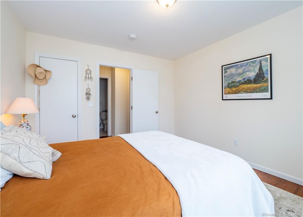 115 Main Street, Unit 5 Norwalk, CT 06851 - Photo 22 of 23 a bedroom with a bed and lamp