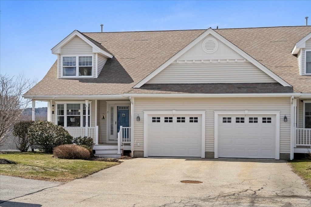7 Primmett Lane, Unit 7 Worcester, MA 01609 - Photo 2 of 38 a front view of a house with garage
