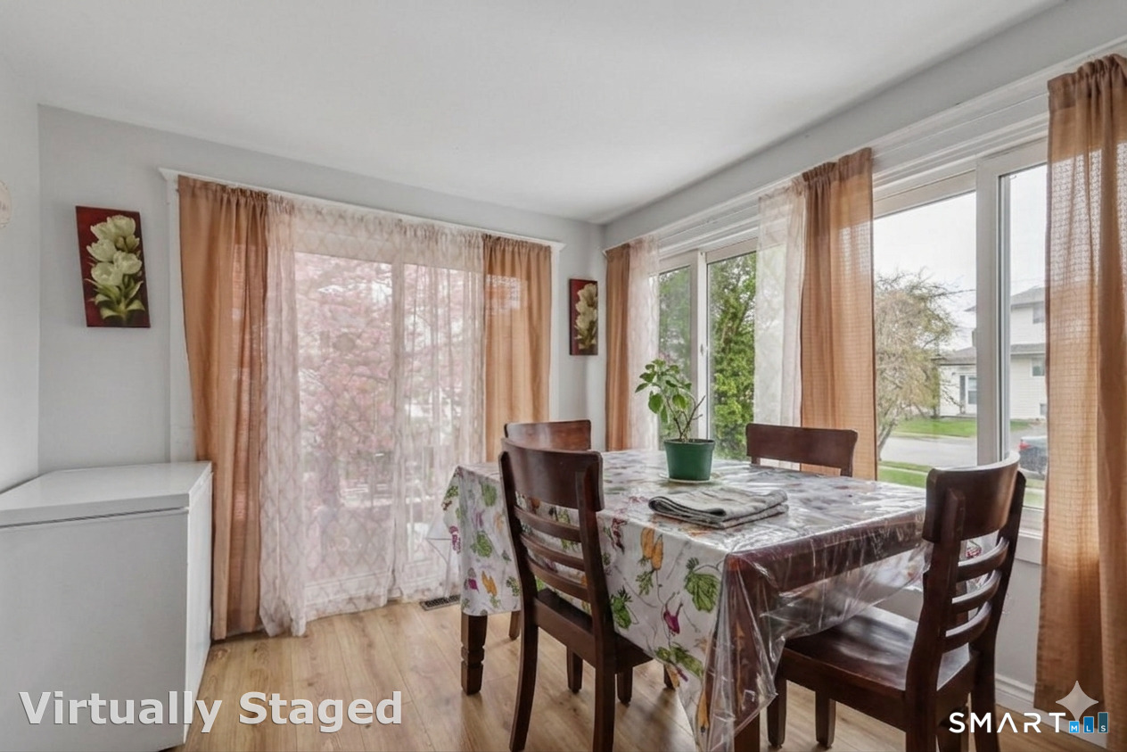 37 Manhan Street Waterbury, CT 06710 - Photo 9 of 19 a view of a dining room with furniture window and outside view
