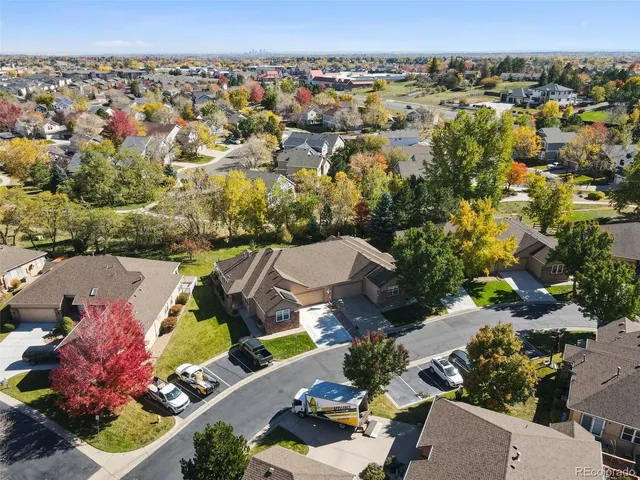 an aerial view of a house with a garden