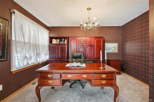 a room with pool table and windows