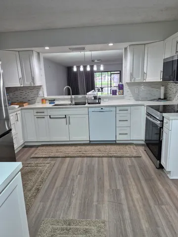 a large kitchen with cabinets