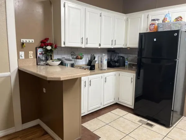 a kitchen with a sink and cabinets