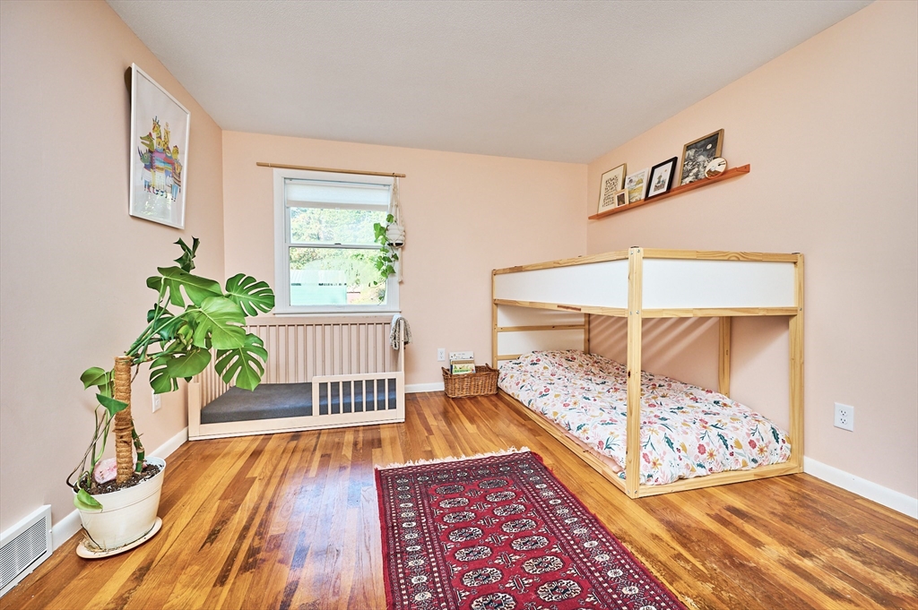 795 A Westhampton Road Northampton, MA 01062 - Photo 14 of 25 a bed sitting in a bedroom next to a window