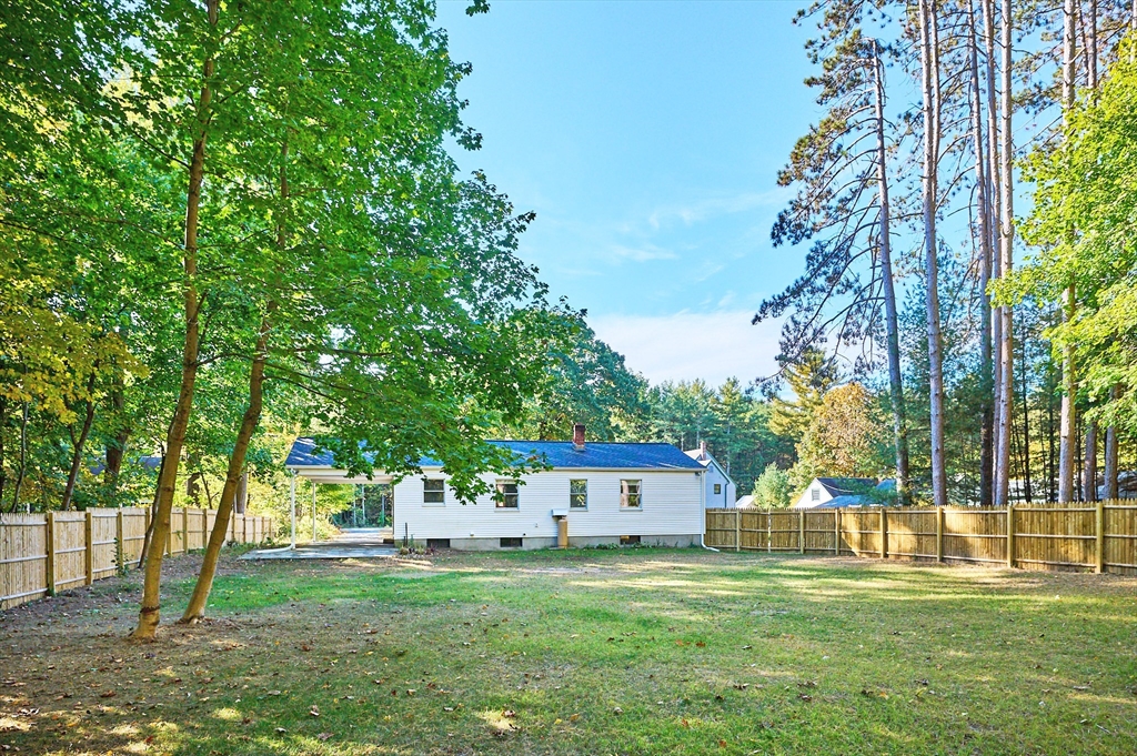 795 A Westhampton Road Northampton, MA 01062 - Photo 23 of 25 a front view of a house with a garden and trees