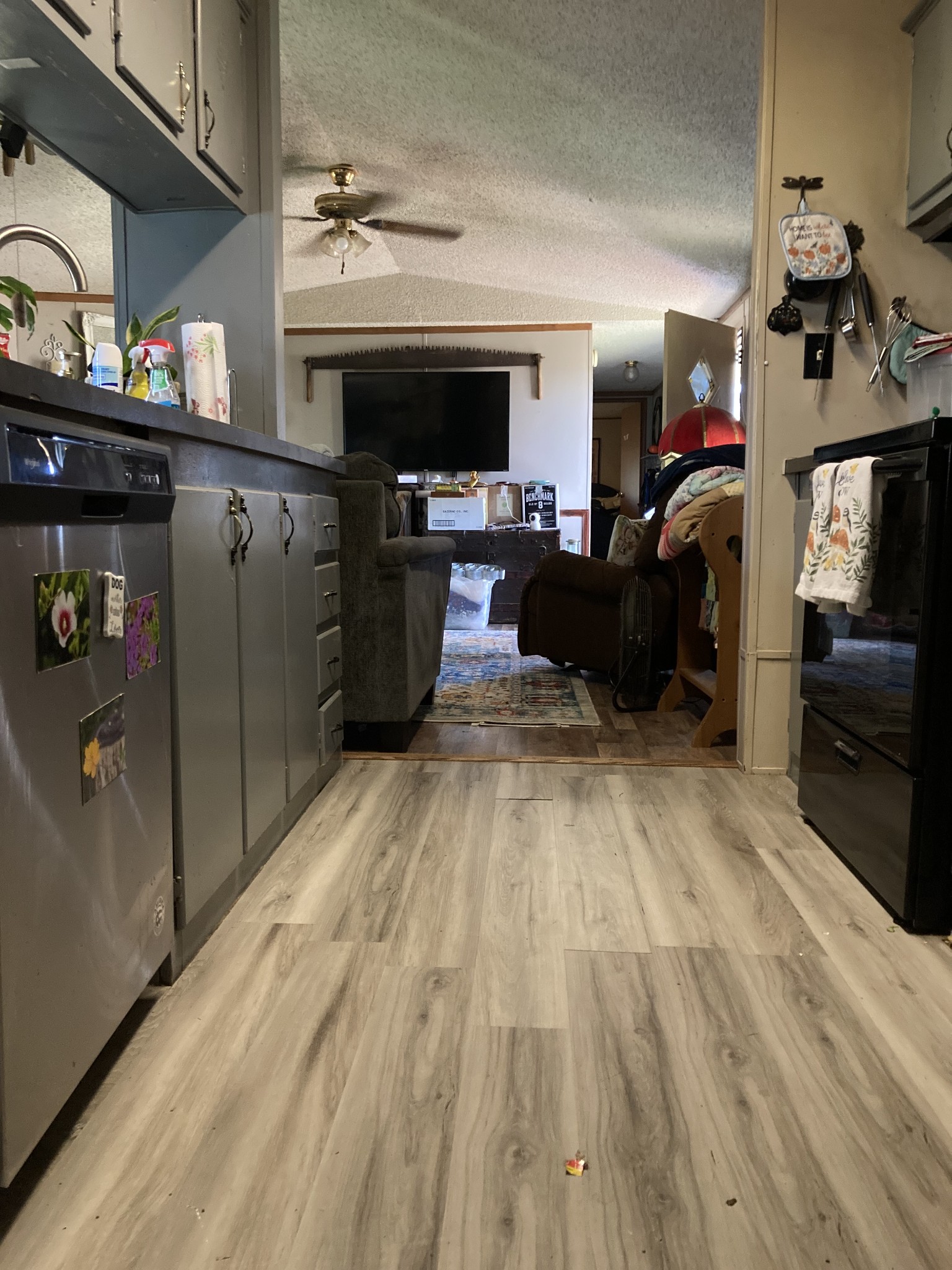 472 Allen Chapel Road Hilham, TN 38568 - Photo 7 of 28 a living room with stainless steel appliances kitchen island granite countertop a refrigerator and a sink