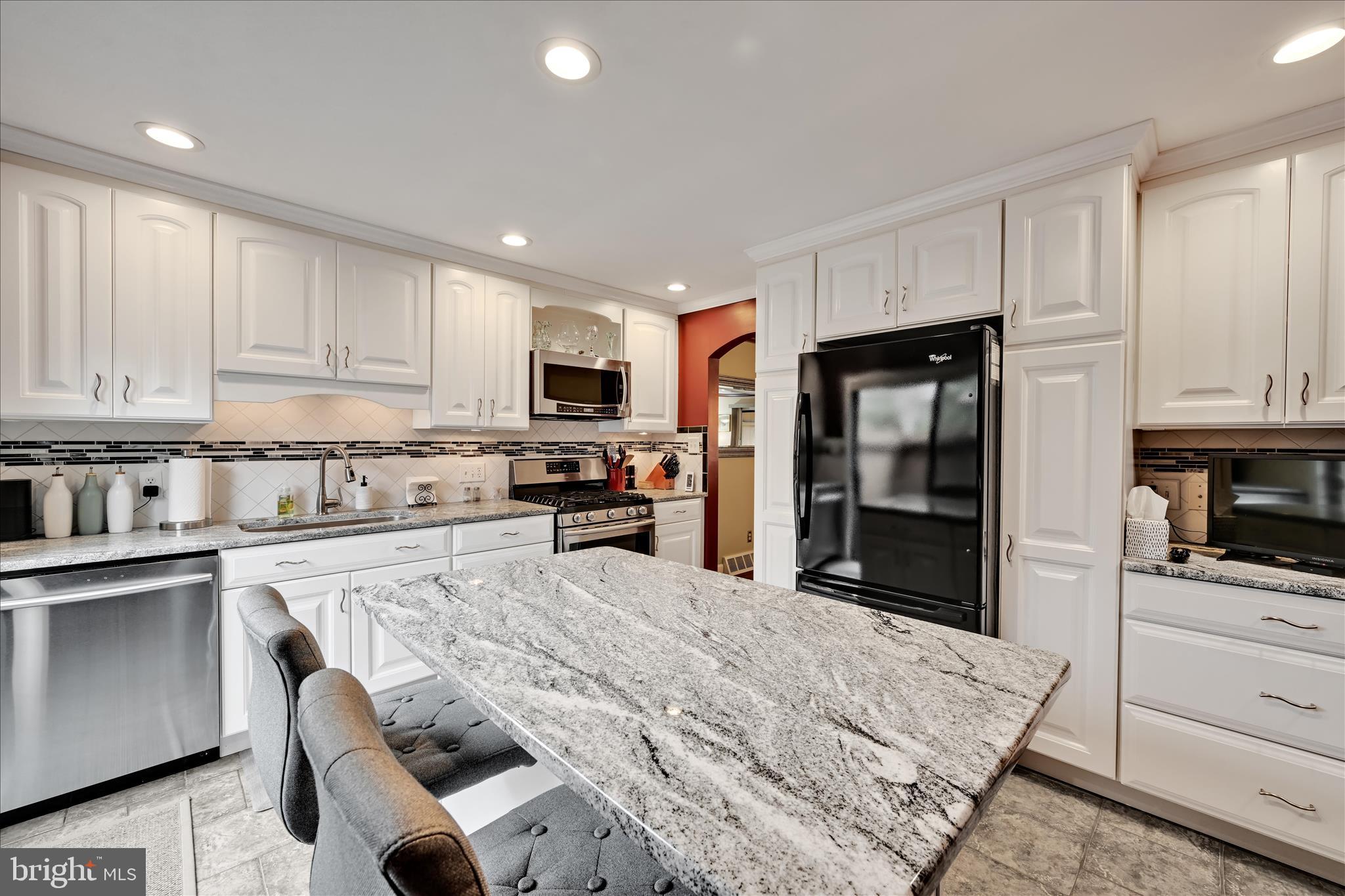 57 Wood Circle Reading, PA 19607 - Photo 16 of 46 a kitchen with granite countertop white cabinets and stainless steel appliances