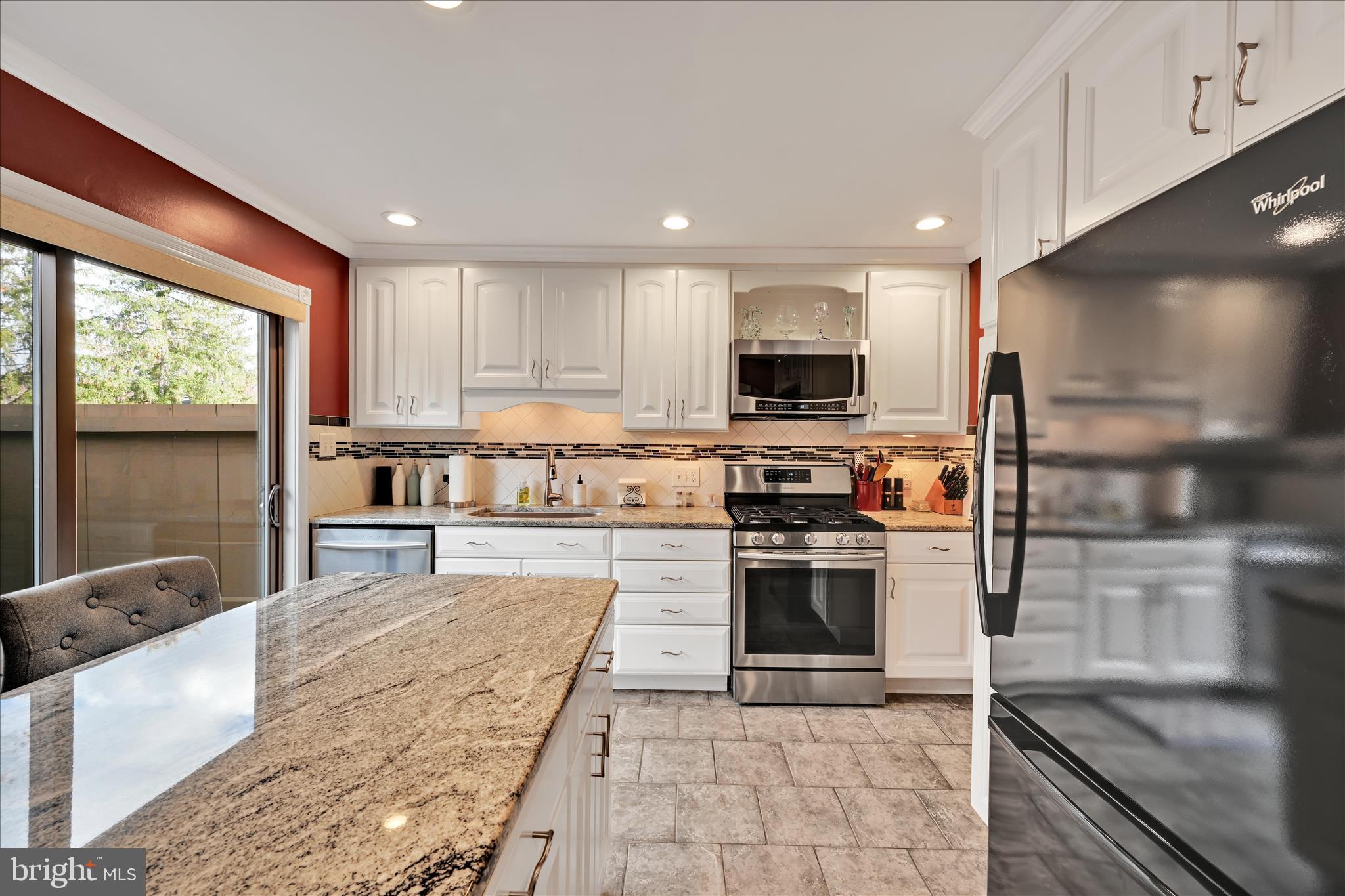 57 Wood Circle Reading, PA 19607 - Photo 18 of 46 a kitchen with stainless steel appliances granite countertop a stove top oven a sink a counter space and cabinets