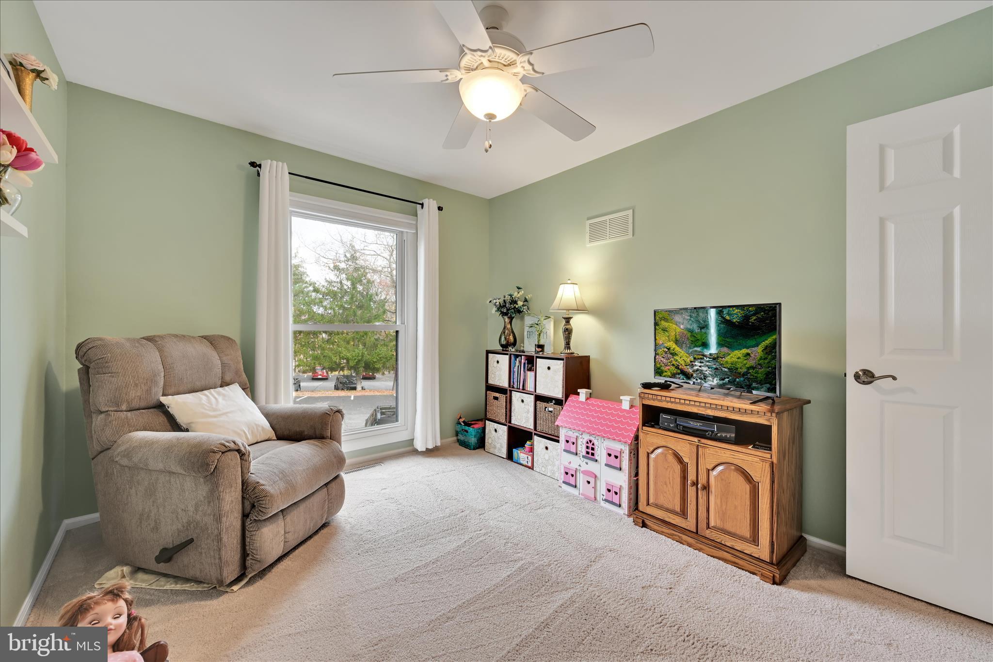 57 Wood Circle Reading, PA 19607 - Photo 22 of 46 a bedroom with furniture and a flat screen tv