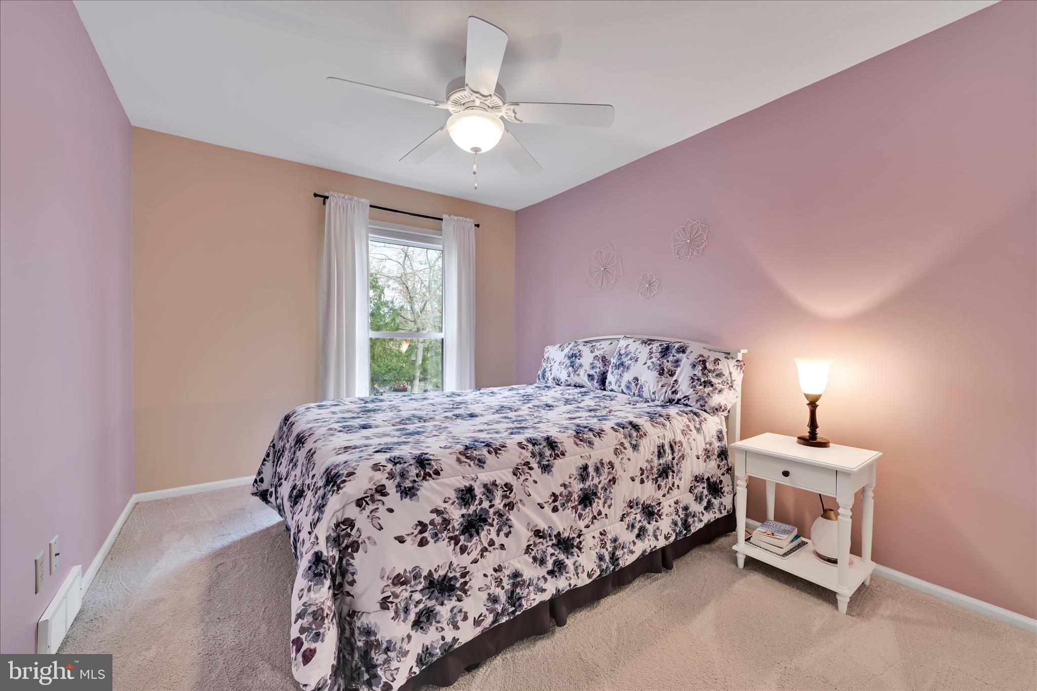 57 Wood Circle Reading, PA 19607 - Photo 24 of 46 a bedroom with a bed and a chandelier
