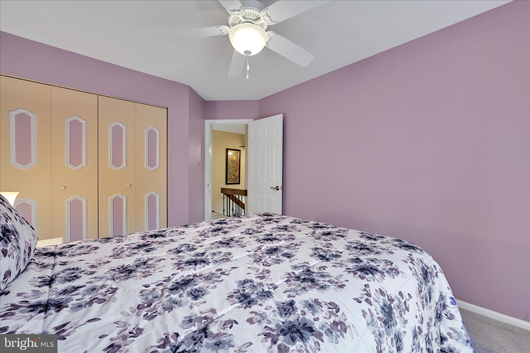 57 Wood Circle Reading, PA 19607 - Photo 25 of 46 a bedroom with a bed and a chandelier