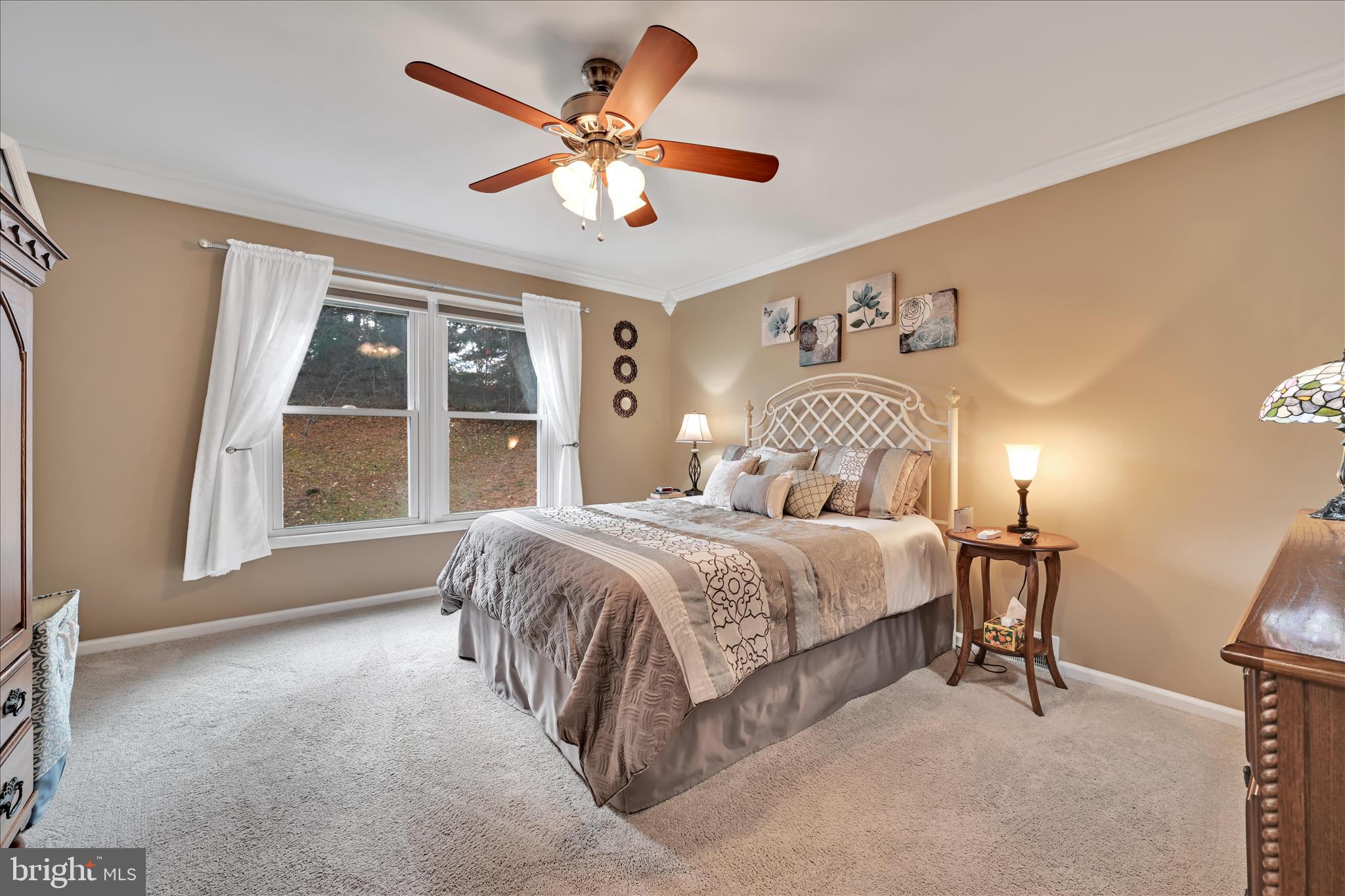 57 Wood Circle Reading, PA 19607 - Photo 28 of 46 a bedroom with a large bed and a large window