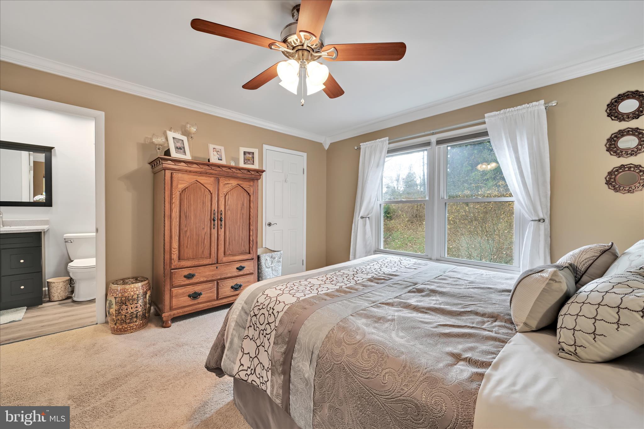 57 Wood Circle Reading, PA 19607 - Photo 29 of 46 a bedroom with a bed dresser and a large window