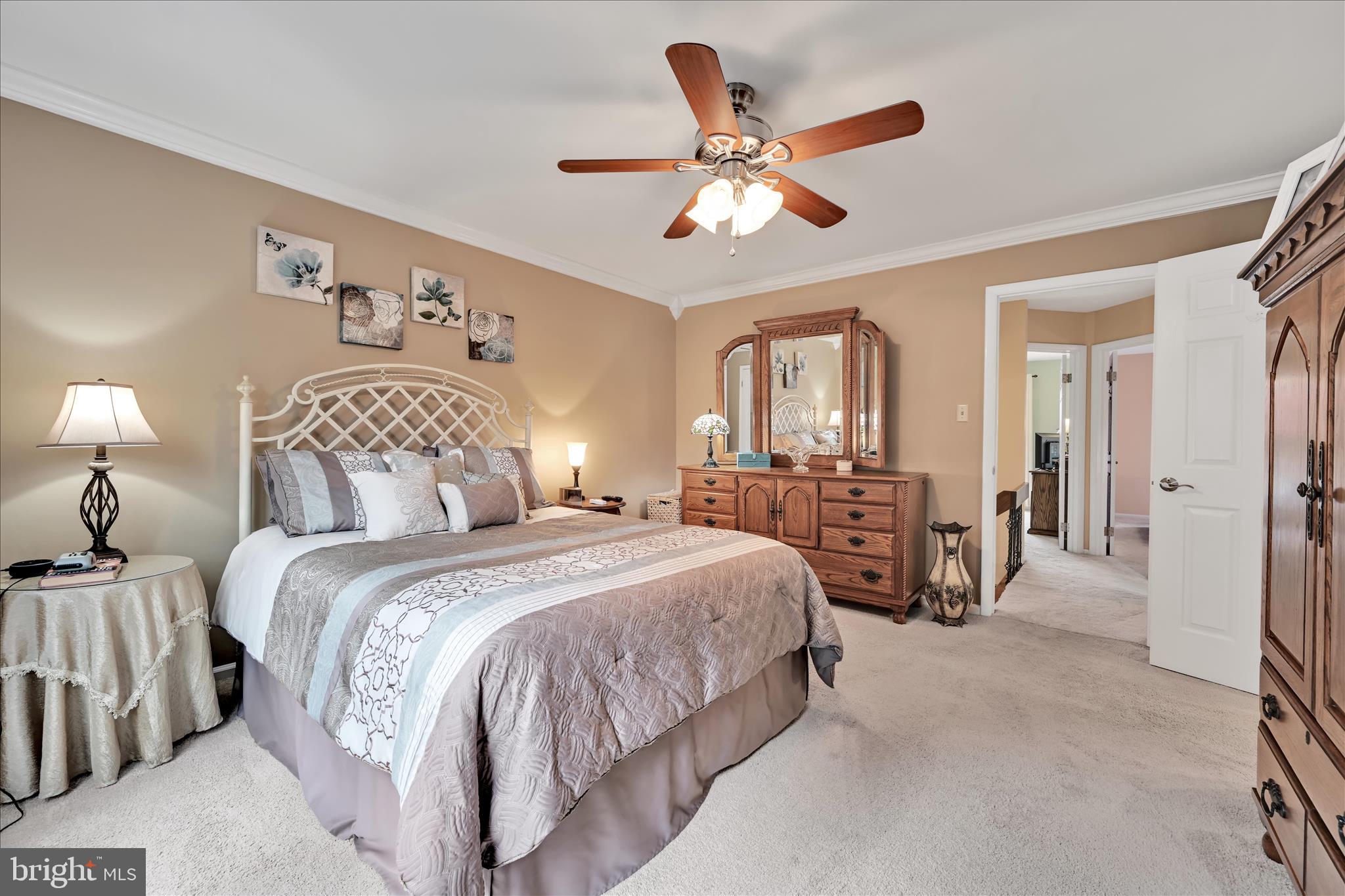 57 Wood Circle Reading, PA 19607 - Photo 30 of 46 a bedroom with bed and a chandelier