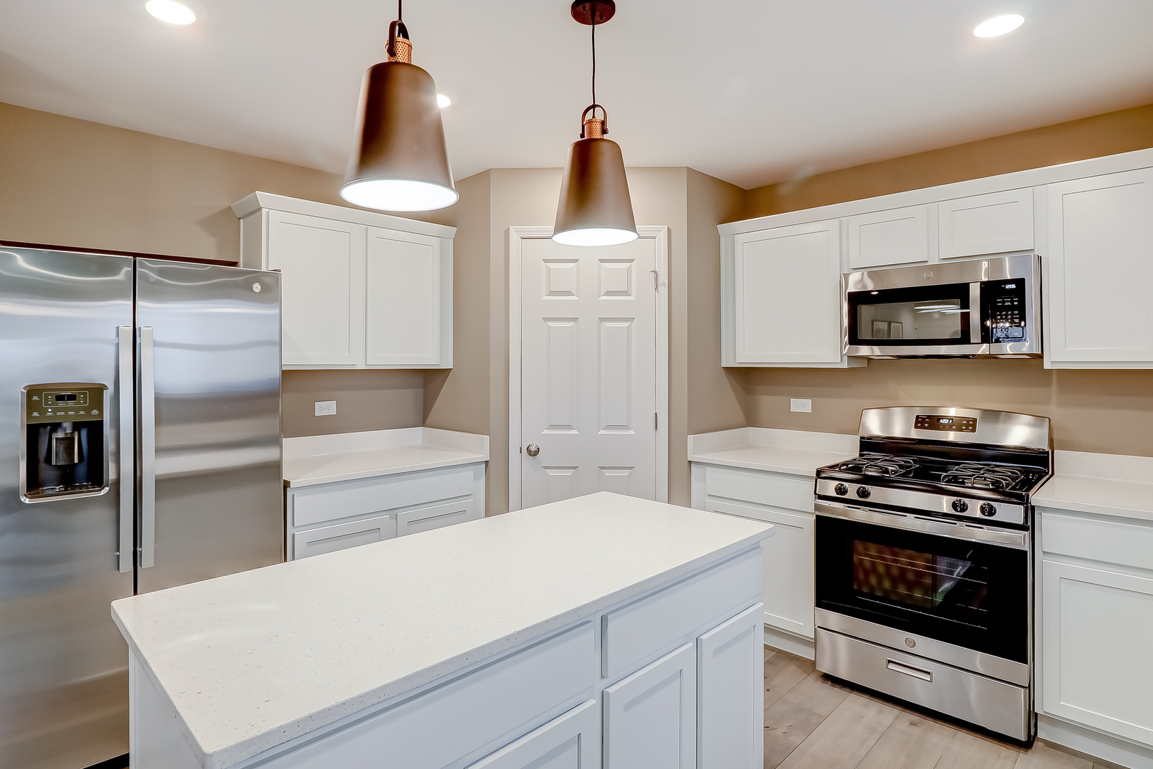 313 Monica Lane Oswego, IL 60543 - Photo 11 of 34 a kitchen with a refrigerator stove and microwave