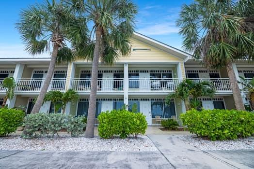 611 Destiny Drive, Unit 210 Ruskin, FL 33570 - Photo 14 of 48 a front view of house with yard and green space