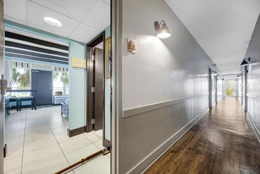 611 Destiny Drive, Unit 210 Ruskin, FL 33570 - Photo 21 of 48 a view of a hallway with dining area and glass door
